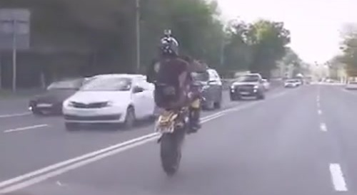 Stupid biker does trick, hits truck and fucking explodes