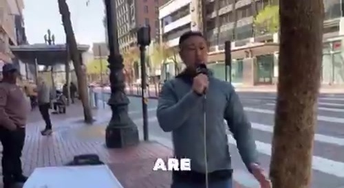 Tranny pulls gun on street preacher.