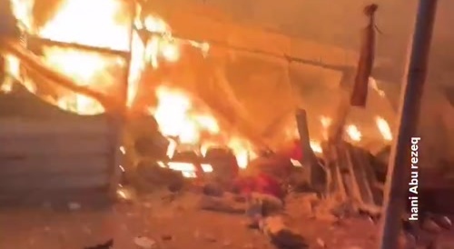 Footage of a  hospital and patients burning