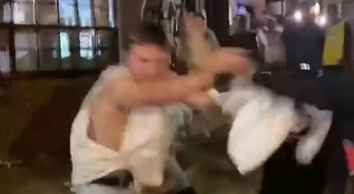White guy knocks out black guy