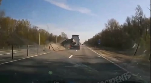 Car spins, after hit by truck