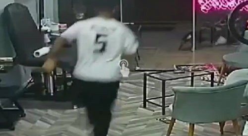 A random tattooist being grabbed or something