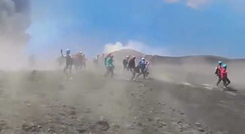 Tourists and guides run for their lives when Mount Etna suddenly erupts