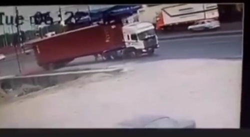 Woman crushed by container