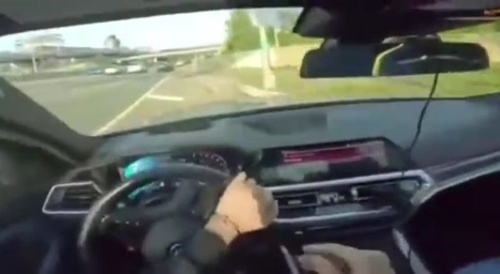 BMW crashes while racing on highway
