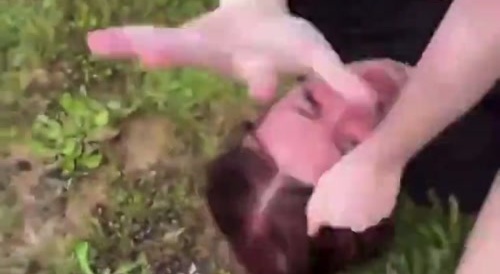 Girl pin downs another girl