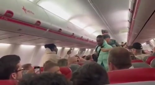Black Man on Plane Escorted outta Plane by Cops