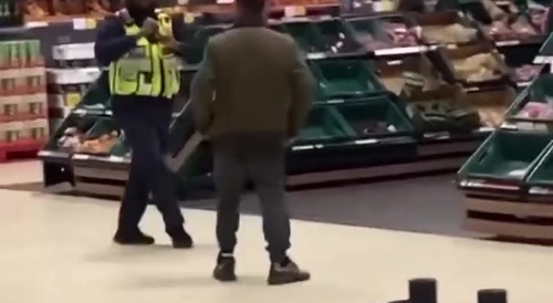 Punk Harrases Security Guard until a Gutzy Citizen Intervenes
