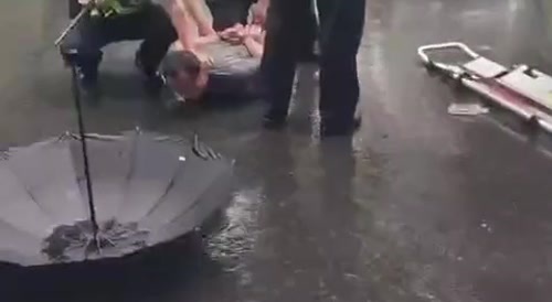 Dude starts stabbing guy on stretcher