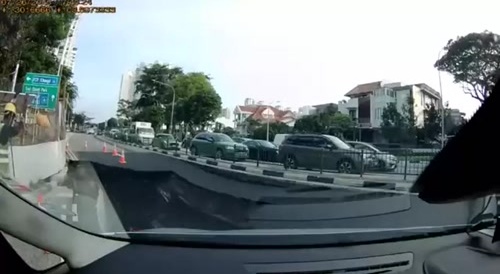 Car falls into sinkhole at roadworks...