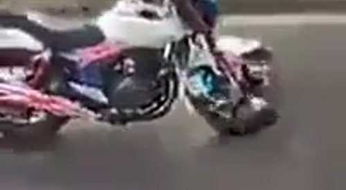 doing push ups on his bike