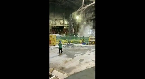 Excavator falls in industrial facility shaft