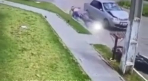 Motorcycle hits car