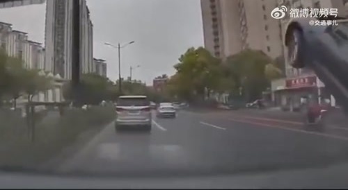 Car jumps of loose manhole cover