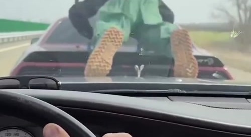 Pushing ups at 120mph outside the car