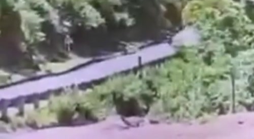 Biker nearly smashed by giant falling rock... !