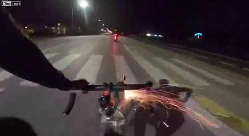 Cyclist launches fireworks at Scooter couple