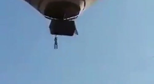 Tourist 'falls' from hot air balloon... !