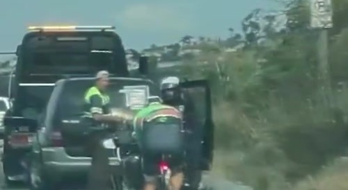 Police obstruct cyclist's path