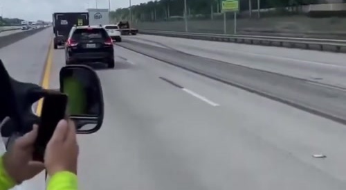 Car stuck under truck.