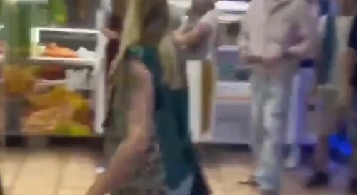Many people fighting in a small supermarket...