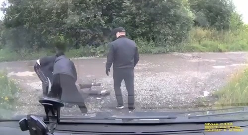 Russian man being beaten and clubbed by a male threesome...