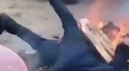 drunk russian falls into fire