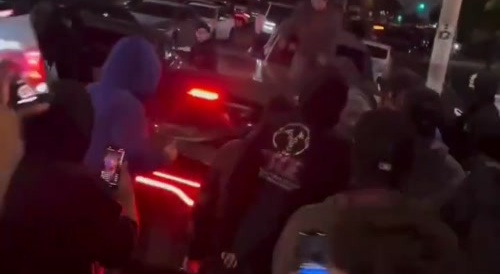 People destroying someone’s car and then beating them after..