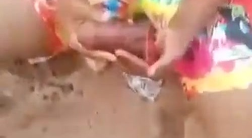 Black woman has a penis in her hands... !