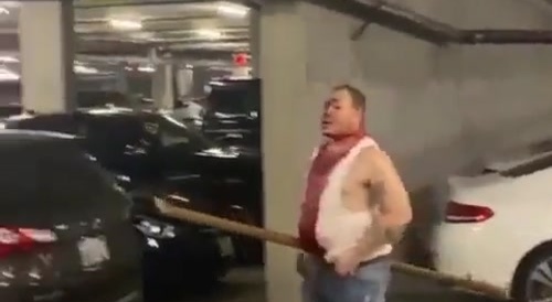 Man walking around with a pole through arse & belly... !