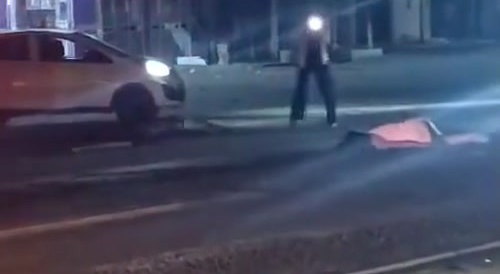 A hooker is being run over by a big truck... !