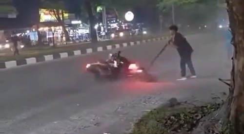 2 spinning motorcycles locked in a dance...