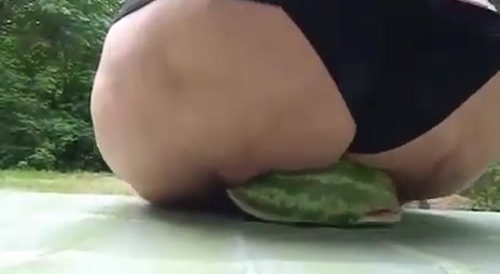 fat woman crushes watermelon