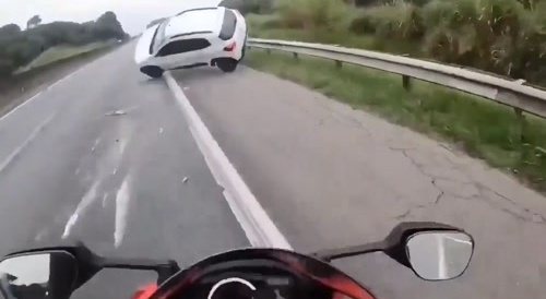 Someone crashes into motorcyclist.