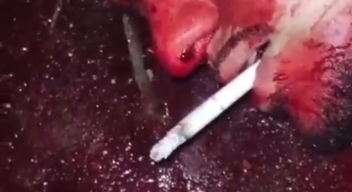 Beheaded & dismembered man is given a cigarette... !