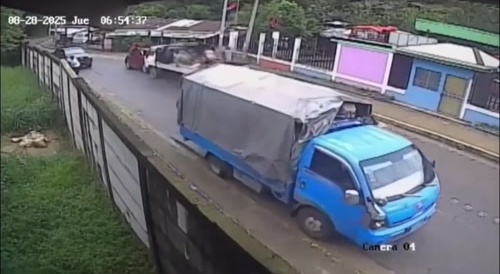 Out Of Control Truck Crashes Into Car Sending It Into Guy Sitting On Side Of Road