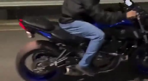 Motorbiker does stoppie & falls... !