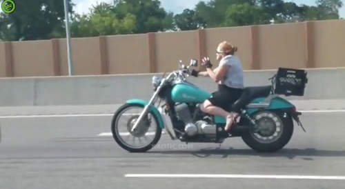 Chick on a bike tweaking