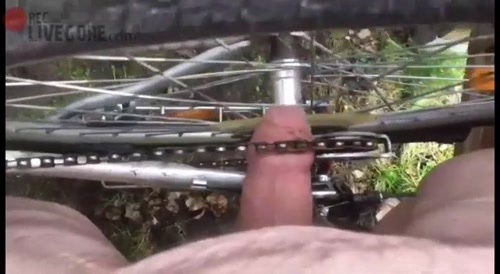 A man sticks his penis under a bicycle chain & rotates it... !