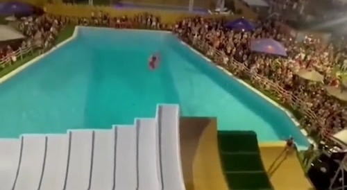 man jumps on giant slide