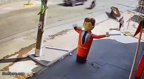 Woman Gets Ran Over By A Wagon In Front Of An Oblivious Balloon Man