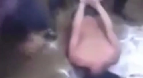 Man Squeals Like A pig While Having His Head Removed