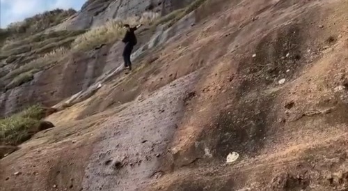 The man rolled down while descending the cliff