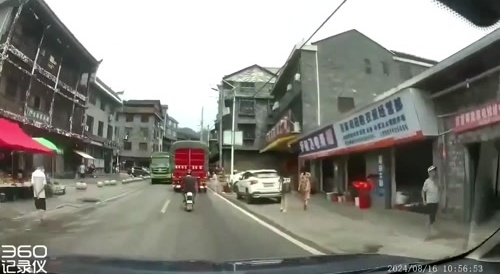 China: Woman Hit By Truck After Running Across The Street Without Checking Traffic