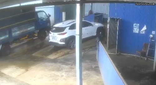 Car Going Up Ramp Crushes Woman