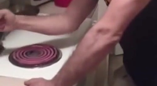Man burns his forearm intentionally on an electric hot plate... !