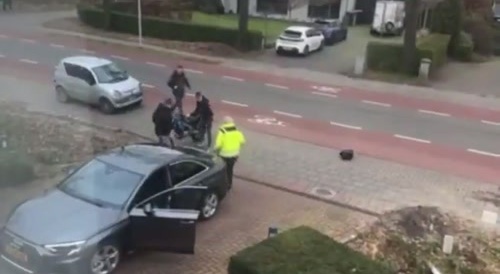 Biker crashes into new Audi delivery
