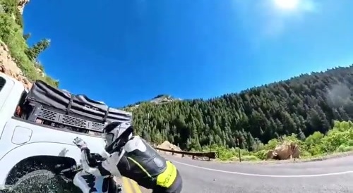 Biker crashes into truck