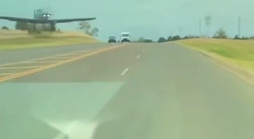 Car almost hits plane landing on highway