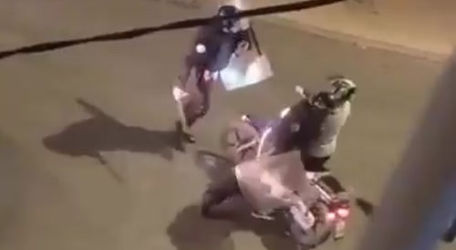 A biker is beaten by cops for driving on the road
